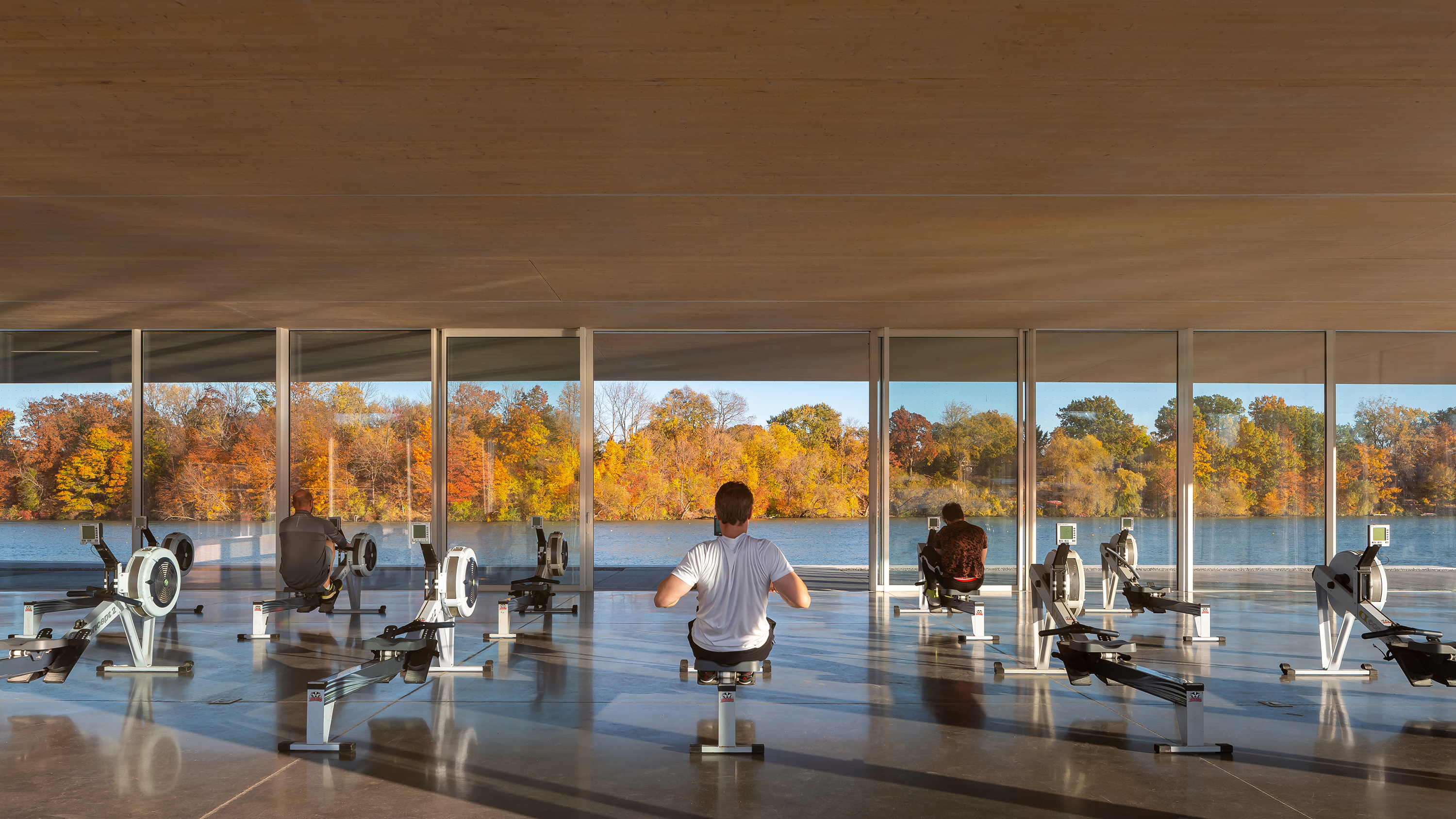 Erg room with open sliding doors and views facing east toward the Martindale Pond and Rowing Course.